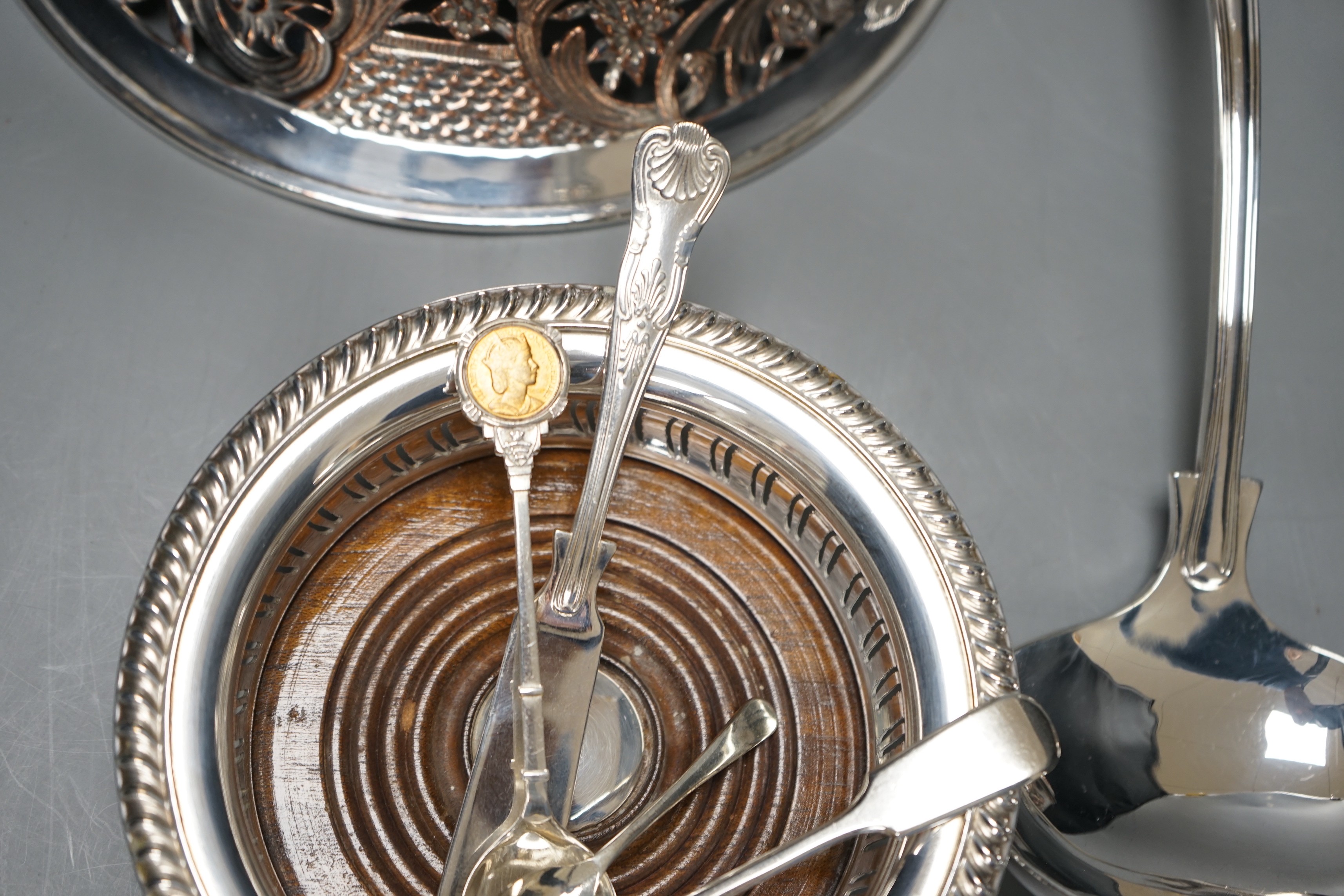 A plated dish ring, a pair of plated coasters, electrotype box, platted basting spoon and soup ladle and four spoons